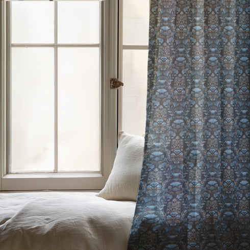 Sheer curtain panel featuring repeating gold hamsa hands surrounded by blue botanical flowers and leaves on dark navy background. Linen-textured polyester fabric filters light while providing elegant window covering with protective symbolism for bohemian or Victorian interiors.